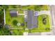 Aerial view showcases a well-maintained yard with a pool, patio, and ample green space at 2529 Hunters Trail, Myrtle Beach, SC 29588