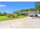 Spacious driveway leading to a lovely home with attractive landscaping and an inviting front porch at 2529 Hunters Trail, Myrtle Beach, SC 29588