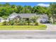 Single-Gathering home featuring a well-manicured lawn, lush landscaping, and inviting front porch at 2529 Hunters Trail, Myrtle Beach, SC 29588