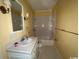 A simple bathroom featuring a tub, shower, and white vanity at 274 Widgeon Dr., Pawleys Island, SC 29585
