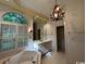 Bright bathroom with a soaking tub, chandelier, and plantation shutters at 274 Widgeon Dr., Pawleys Island, SC 29585