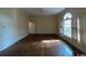 Sun-filled bedroom with hardwood floors and large windows with white shutters at 274 Widgeon Dr., Pawleys Island, SC 29585