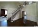Grand foyer with a staircase, chandelier, and hardwood floors at 274 Widgeon Dr., Pawleys Island, SC 29585