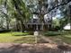 Charming traditional home with mature trees and lush landscaping, including a mailbox at 274 Widgeon Dr., Pawleys Island, SC 29585