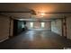 A bright, clean garage with overhead lighting, and an empty floor at 274 Widgeon Dr., Pawleys Island, SC 29585