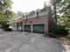 Spacious two-car garage with green doors in a brick home at 274 Widgeon Dr., Pawleys Island, SC 29585