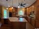 Gorgeous kitchen with wooden cabinets, granite counters, an island, and modern appliances at 274 Widgeon Dr., Pawleys Island, SC 29585