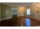 A bright living room with hardwood floors, built-in shelving and lovely natural light at 274 Widgeon Dr., Pawleys Island, SC 29585