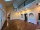 Spacious living room with hardwood floors, large windows, and built-in cabinets at 274 Widgeon Dr., Pawleys Island, SC 29585