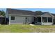 Backyard of a single-story home featuring a shed, screened in porch and well-maintained lawn at 298 Weyburn St., Myrtle Beach, SC 29579