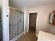 Bathroom featuring glass door shower stall, and doorway to closet at 298 Weyburn St., Myrtle Beach, SC 29579