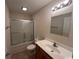 Bathroom featuring a toilet, tub, vanity, and a well-lit mirror at 298 Weyburn St., Myrtle Beach, SC 29579