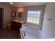 Bright bathroom boasts a garden tub, vanity with neutral countertop and big window at 298 Weyburn St., Myrtle Beach, SC 29579