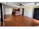 Spacious open concept room with ceiling fan, hardwood floors and brick kitchen bar at 298 Weyburn St., Myrtle Beach, SC 29579