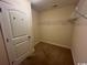 Spacious walk-in closet with carpeted floor, wire shelving, and a door at 298 Weyburn St., Myrtle Beach, SC 29579