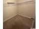 Empty walk-in closet has carpet and wire shelving for easy storage at 298 Weyburn St., Myrtle Beach, SC 29579
