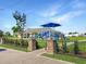 Blue and white playground in a gated area with a gazebo in the background at 301 Farmtrac Dr., Galivants Ferry, SC 29544