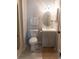 Cozy bathroom featuring a toilet and vanity with a modern sink and an oval mirror at 3015 Old Bryan Dr. # 4, Myrtle Beach, SC 29577