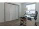 Office featuring a work desk, office chair, bright natural light, and a closet space with folding doors at 3015 Old Bryan Dr. # 4, Myrtle Beach, SC 29577