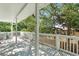 A nice back deck with white railings and view of trees at 304 1St Ave. N, Myrtle Beach, SC 29577