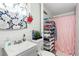 Well-organized bathroom with ample storage and a patterned window curtain at 304 1St Ave. N, Myrtle Beach, SC 29577