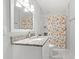 Bright bathroom featuring granite countertops, a walk-in shower, and tiled flooring at 304 1St Ave. N, Myrtle Beach, SC 29577