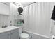 Clean bathroom with a shower-tub combination, white tile, and neutral-toned walls at 304 1St Ave. N, Myrtle Beach, SC 29577
