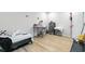 Neutral-toned bedroom featuring a bed, desk and minimal decor, with hardwood flooring at 304 1St Ave. N, Myrtle Beach, SC 29577