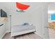 Simple bedroom featuring single bed, neutral walls, and a sunny window at 304 1St Ave. N, Myrtle Beach, SC 29577