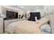 Bedroom featuring neutral walls, a queen-size bed, and lots of decor at 304 1St Ave. N, Myrtle Beach, SC 29577