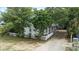 Charming two-story home with a white picket fence and lush landscaping at 304 1St Ave. N, Myrtle Beach, SC 29577