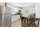 Eat-in kitchen with stainless steel refrigerator and wooden table at 304 1St Ave. N, Myrtle Beach, SC 29577