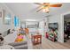 Bright living room flows into a fully-equipped kitchen and dining area, with laminate flooring at 304 1St Ave. N, Myrtle Beach, SC 29577
