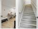 Brightly lit staircase with neutral-toned walls and modern finishes, leading to bedrooms at 304 1St Ave. N, Myrtle Beach, SC 29577