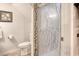 Modern bathroom features a sleek glass shower door, toilet, and stylish decor at 306 21St Ave. S # 5H, Myrtle Beach, SC 29577