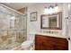 Bathroom showcases a glass-enclosed shower, granite vanity, and modern fixtures at 306 21St Ave. S # 5H, Myrtle Beach, SC 29577