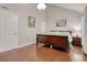 Bright bedroom features wood flooring, a vaulted ceiling, and a wooden bed frame at 306 21St Ave. S # 5H, Myrtle Beach, SC 29577