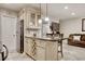 Stylish kitchen island provides additional seating, storage, and counter space at 306 21St Ave. S # 5H, Myrtle Beach, SC 29577