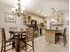 Open-concept kitchen features a breakfast bar, modern appliances, and warm cabinetry at 306 21St Ave. S # 5H, Myrtle Beach, SC 29577
