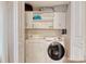 Functional laundry room features shelving, storage space, and modern appliances at 306 21St Ave. S # 5H, Myrtle Beach, SC 29577