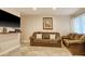 Comfortable living room featuring tile floors and a large comfortable sofa at 306 21St Ave. S # 5H, Myrtle Beach, SC 29577