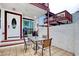 Cozy patio area with tiled flooring, outdoor seating, and a white entry door at 306 21St Ave. S # 5H, Myrtle Beach, SC 29577