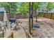 Relaxing backyard featuring an outdoor dining area, hardscape and gravel, perfect for entertaining and leisure at 3969 Murrells Inlet Rd., Murrells Inlet, SC 29576