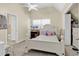 Cozy bedroom with a white bed frame, ceiling fan, and an open closet at 3969 Murrells Inlet Rd., Murrells Inlet, SC 29576