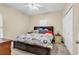 Bedroom featuring a ceiling fan, large bed with pull-out drawers, and a carpeted floor at 3969 Murrells Inlet Rd., Murrells Inlet, SC 29576