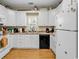 Efficient kitchen featuring white cabinets, laminate countertops, and white appliances at 3969 Murrells Inlet Rd., Murrells Inlet, SC 29576