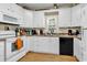 Functional kitchen featuring white cabinets, laminate countertops, and an oven at 3969 Murrells Inlet Rd., Murrells Inlet, SC 29576