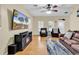 Comfortable living room featuring hardwood floors, ceiling fan, and plenty of natural light at 3969 Murrells Inlet Rd., Murrells Inlet, SC 29576
