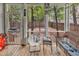 Screened in porch with plenty of seating and views of the fenced in backyard at 3969 Murrells Inlet Rd., Murrells Inlet, SC 29576