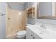 Bathroom with white vanity, toilet and shower with light yellow surround at 4049 Fairway Lakes Dr. # 4049, Myrtle Beach, SC 29577